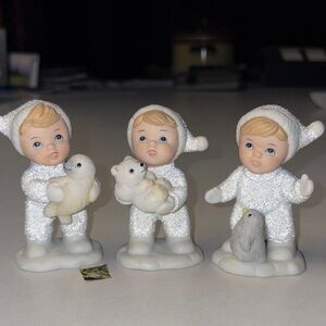 Adorable vintage Homco "Snow Baby" figurine trio